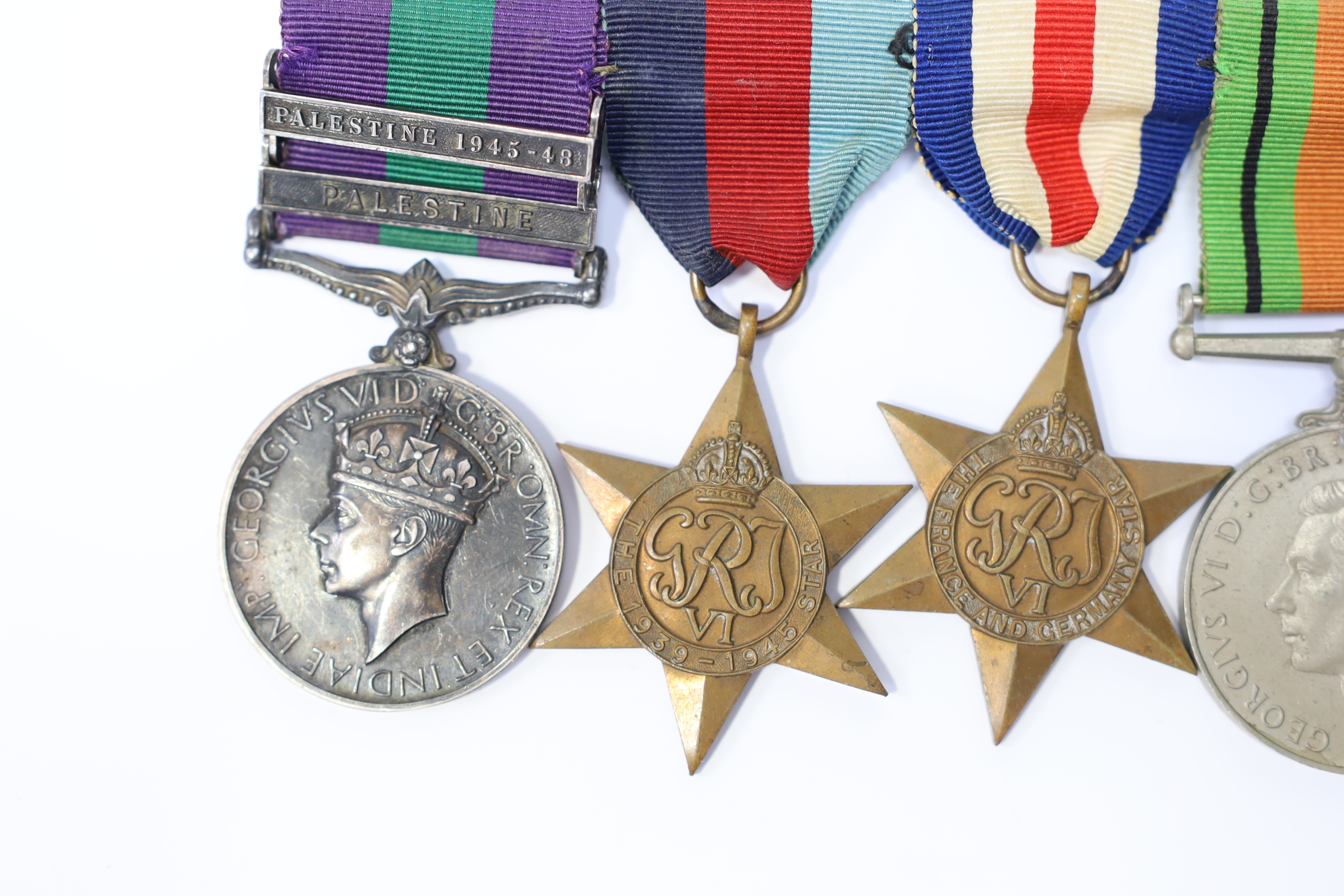 A WWII medal group awarded to Pte. J. Langridge S. Staff, comprising; a General Service Medal with two bars for Palestine and Palestine 1945-48, stamped to the edge with the recipient’s details, together with a 1939-45 S